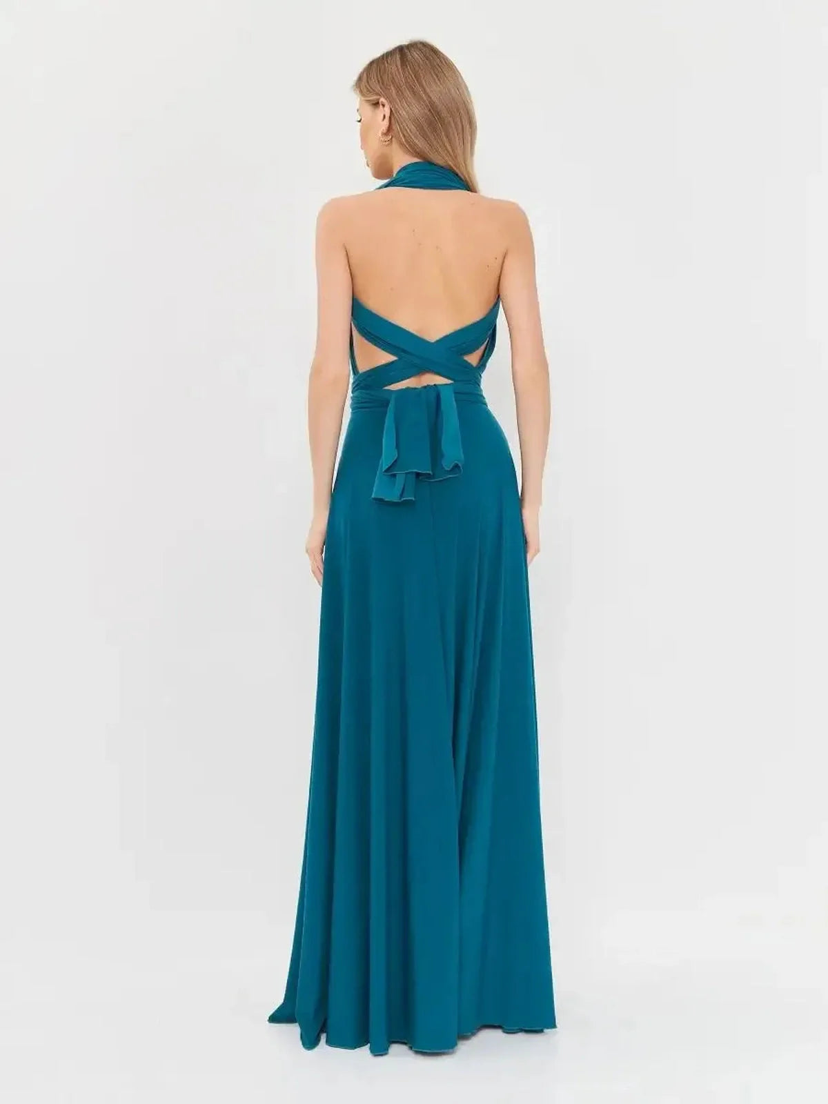 Back view of the deep teal Maxi Dress Cascade Grace with draped halter and flowing skirt.