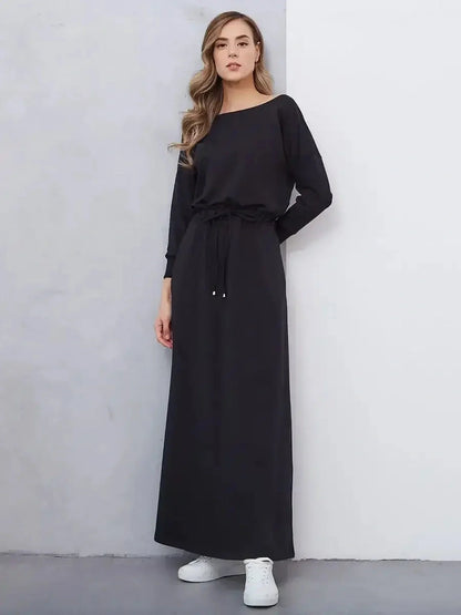 Sleek black maxi dress with cinched waist and relaxed fit, perfect for casual or formal occasions.