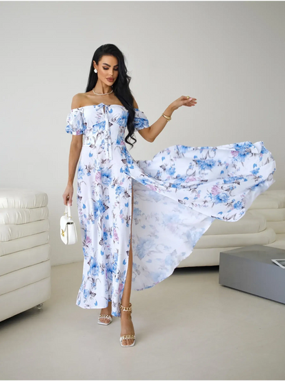 Off-shoulder floral maxi dress with flowing skirt and thigh-high slit, perfect for elegant occasions.