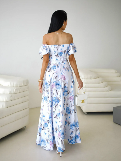 Maxi Dress Fleurienne: Off-shoulder floral design, featuring puff sleeves and a flowing silhouette, ideal for elegant occasions.