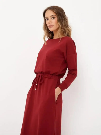 Model wearing a red long sleeve maxi dress with a drawstring waist, perfect for weddings or casual chic occasions.