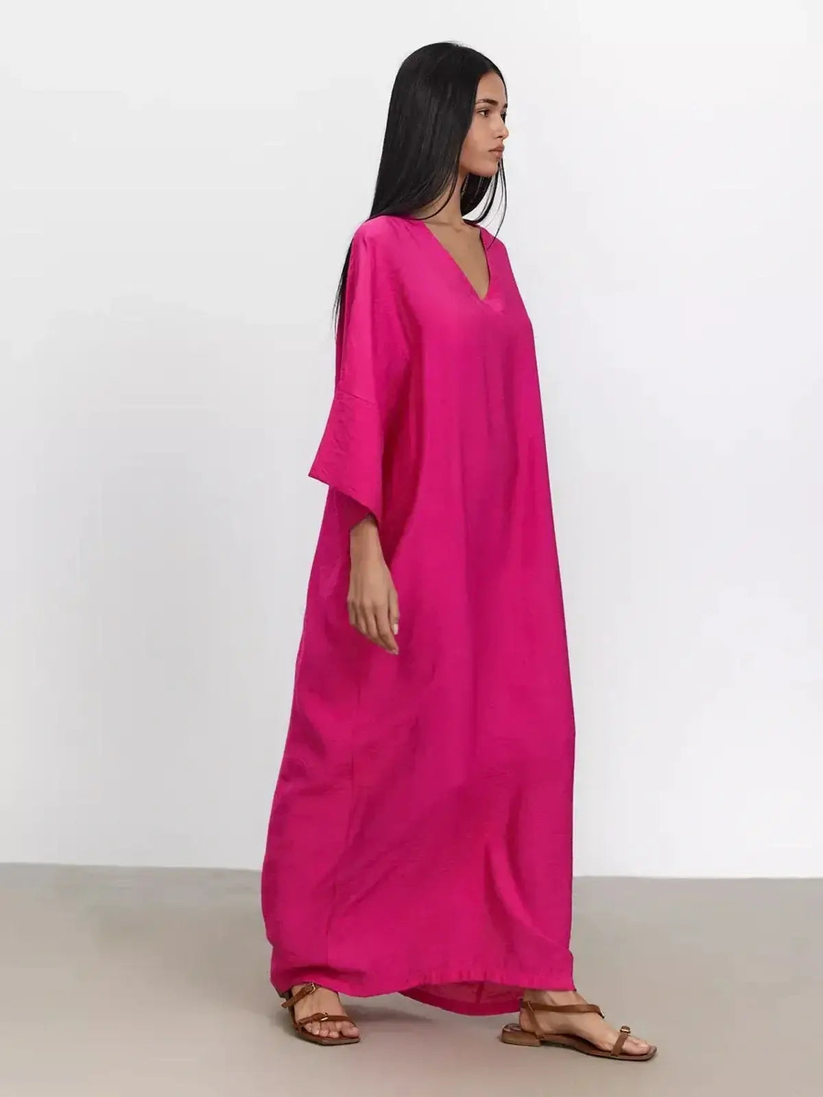 Model wearing a fuchsia Maxi Dress Lush Aura with kimono sleeves and V-neckline, showcasing effortless elegance.