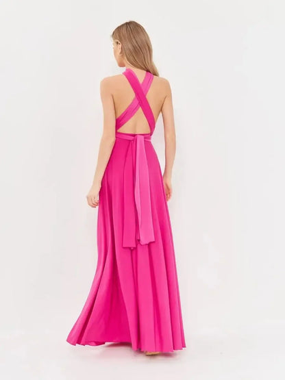 Back view of a pink fuchsia maxi dress with a halter neck and convertible wrap style, perfect for formal occasions.