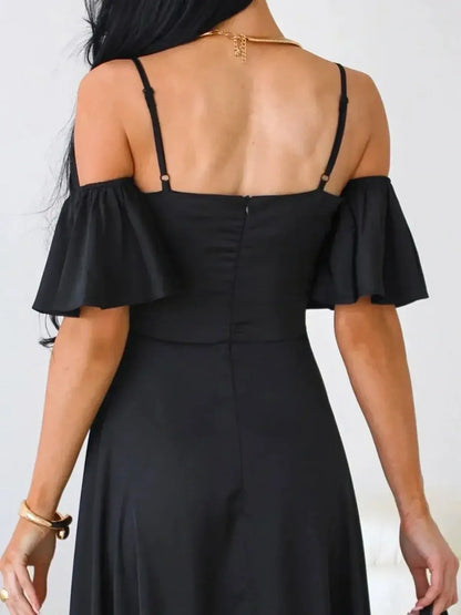 Back view of elegant black maxi dress with off-shoulder flutter sleeves and adjustable straps.