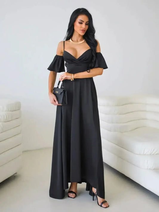 Elegant black maxi dress with off-shoulder flutter sleeves and thigh-high slit, showcasing a modern silhouette.