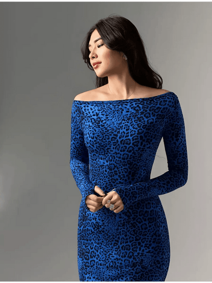Model wearing a sleek long sleeve cobalt blue leopard print maxi dress, showcasing a flattering silhouette.
