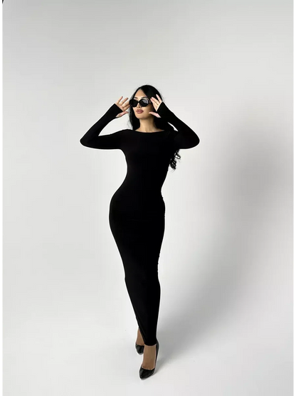 Model wearing the elegant Maxi Dress Noir Allure, showcasing its black long sleeve bodycon silhouette.