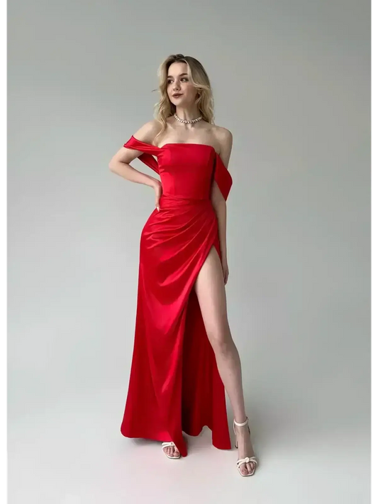 Maxi Dress Scarlet Muse in luxurious red satin featuring off-shoulder design and high leg slit.