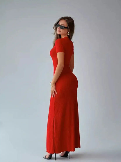Elegant red ribbed maxi dress sculpted to fit, perfect for summer events and wedding guest attire.