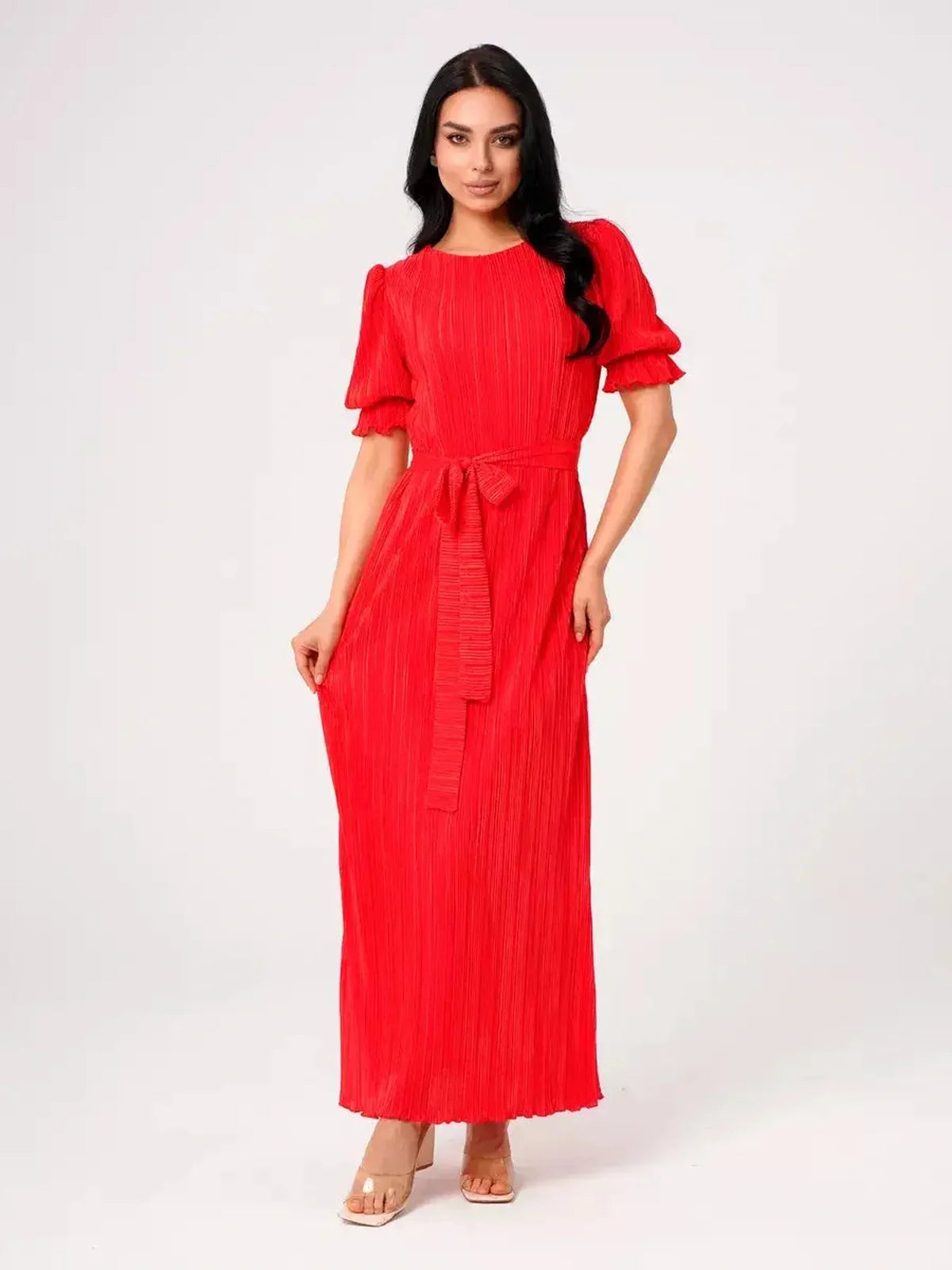 Elegant red Maxi Dress Solaria featuring pleated design, puff sleeves, and a belted waist for a refined summer look.