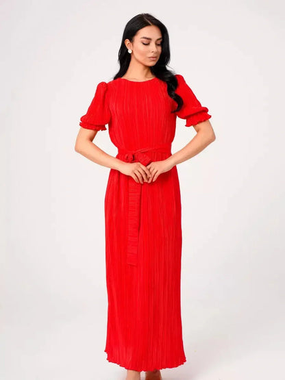 Red pleated maxi dress with puff sleeves and a belted waist, perfect for summer events or wedding guest attire.