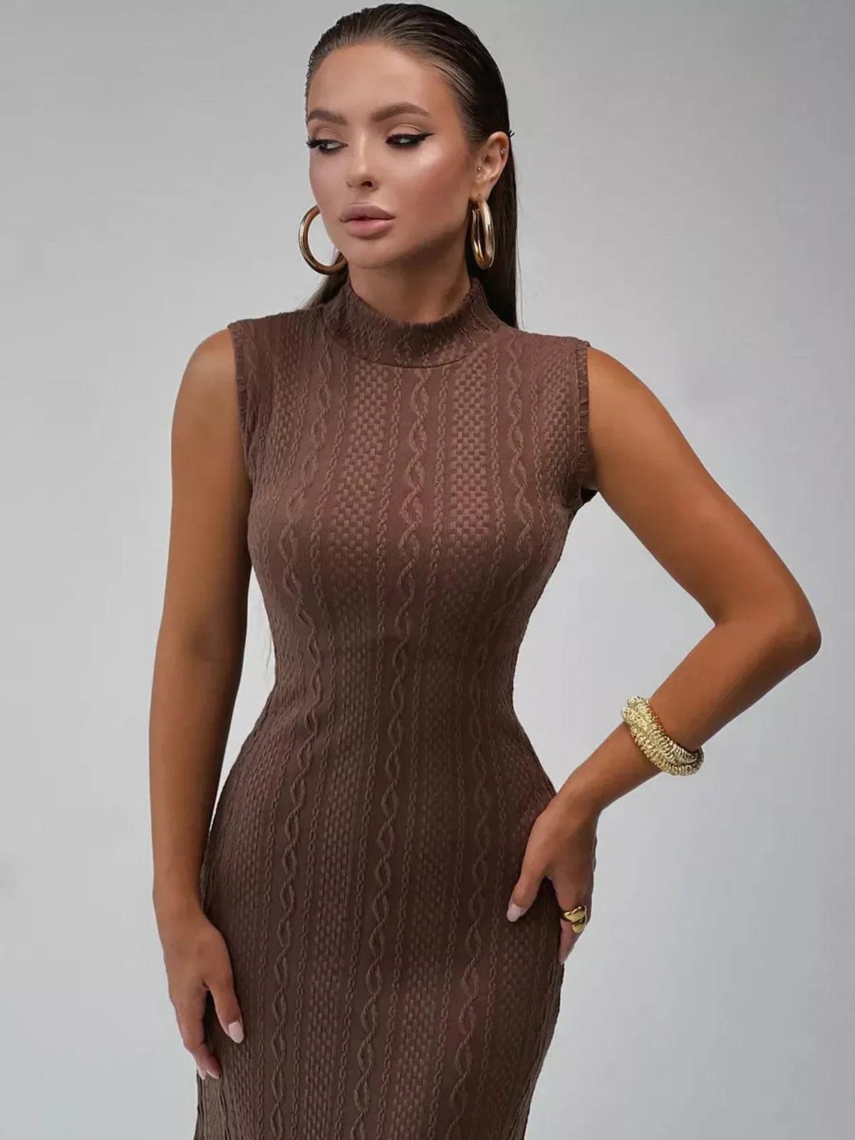 Maxi Dress Terra Cable in textured knit, featuring a sculpted silhouette and mock neckline for confident elegance.