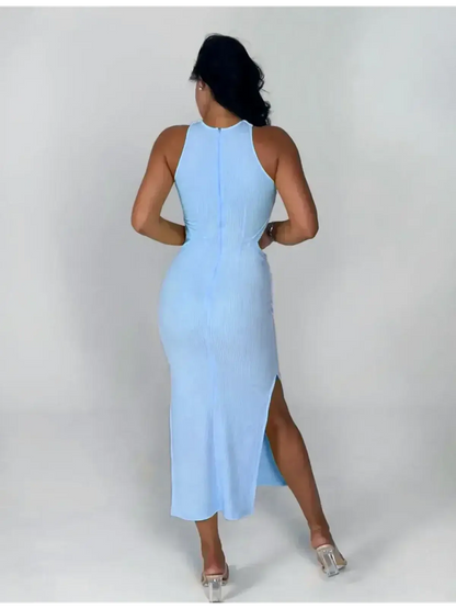 Back view of Midi Dress Azure Charm in light blue, featuring a ribbed knit, halter neck, and bold side slit.