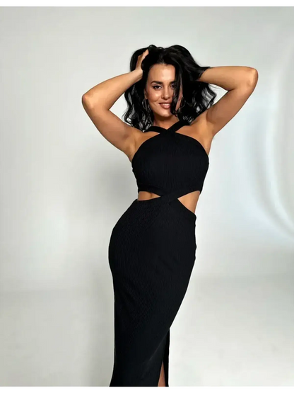 Model showcasing the Midnight Allure Midi Dress with sculpted ribbed texture and striking cutout details.