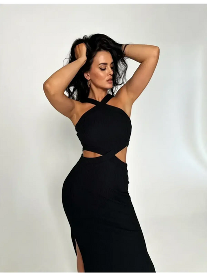 Sculpted black midi dress with cutout waist, cross-strap neckline, and side slit, perfect for elegant occasions.