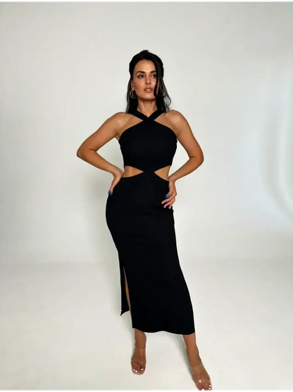 Model showcasing the Midnight Allure Midi Dress with cutouts and a sultry side slit, embodying elegant sophistication.