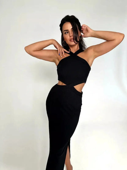 Model showcasing the Midnight Allure Midi Dress with cutout details and a sultry side slit.