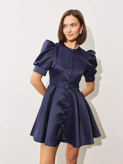Midnight Bloom Mini Dress with puff sleeves and satin finish, perfect for weddings or formal occasions.