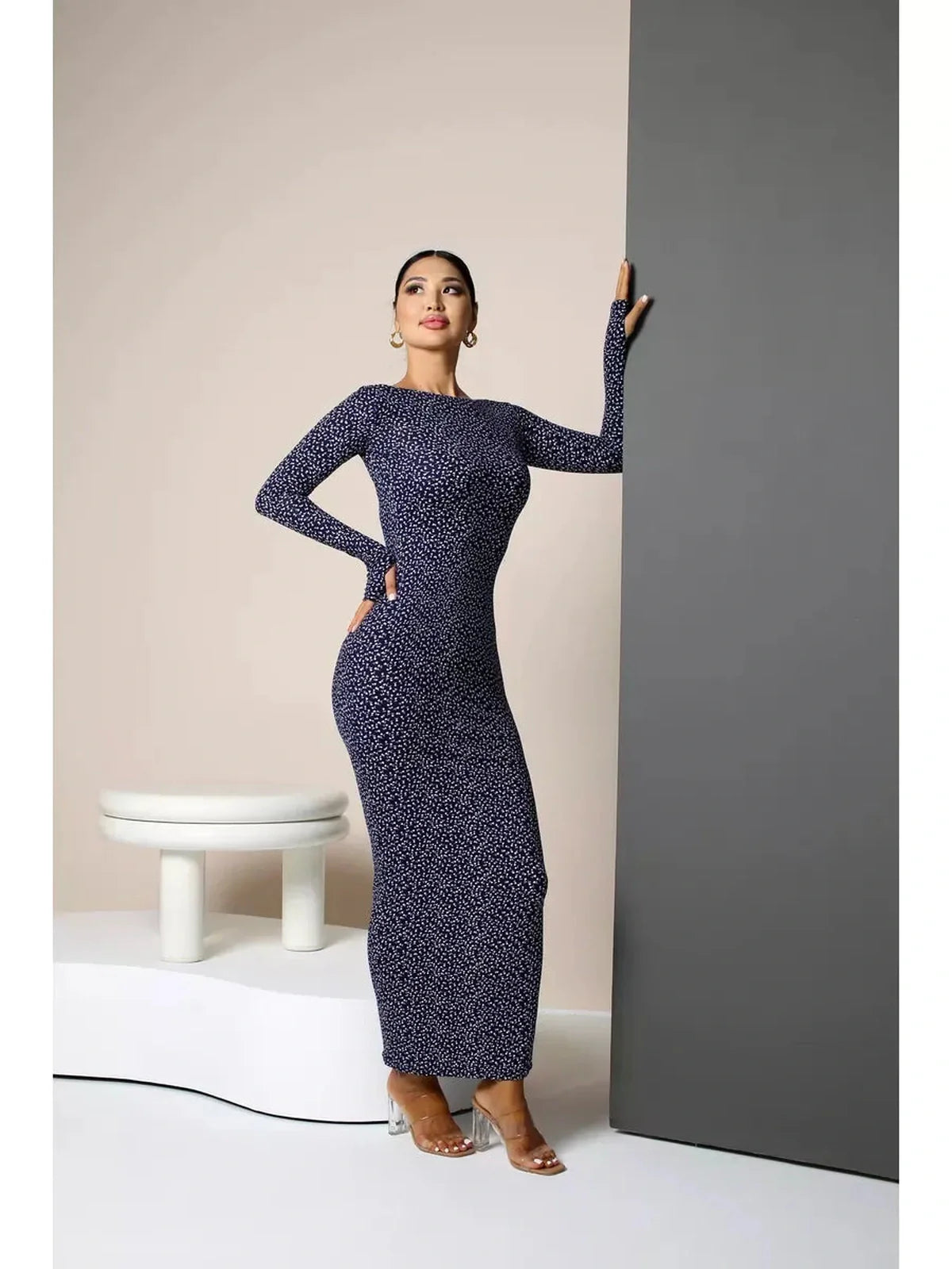 Model wearing Midnight Curve Maxi Dress in dark navy, showcasing its elegant silhouette and sculpting fit.