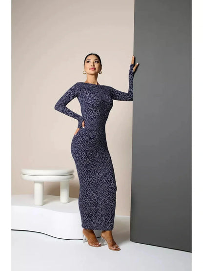 Model wearing Midnight Curve Maxi Dress in dark navy, showcasing its elegant silhouette and sculpting fit.