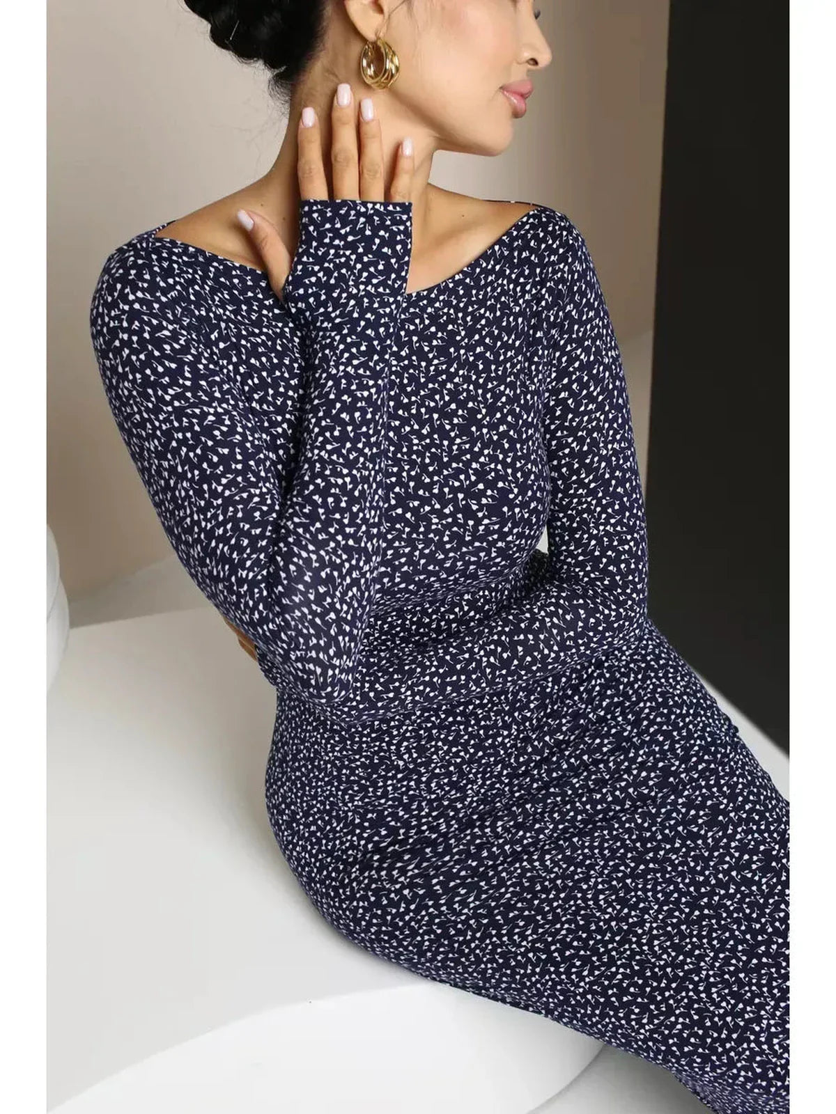 Midnight Curve Maxi Dress in dark navy featuring long sleeves and a sculpted fit, showcasing an elegant silhouette.