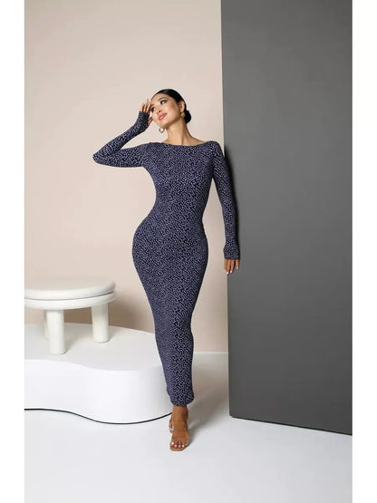 Model showcasing the Midnight Curve Maxi Dress in dark navy, highlighting its sculpted fit and elegant silhouette.