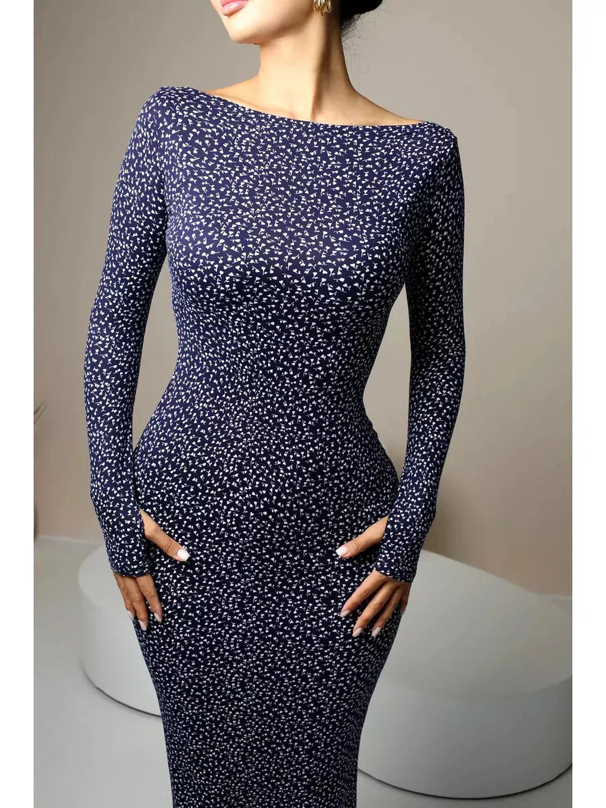 Midnight Curve Maxi Dress in dark navy, featuring a sculpting fit and elegant thumbhole sleeves.