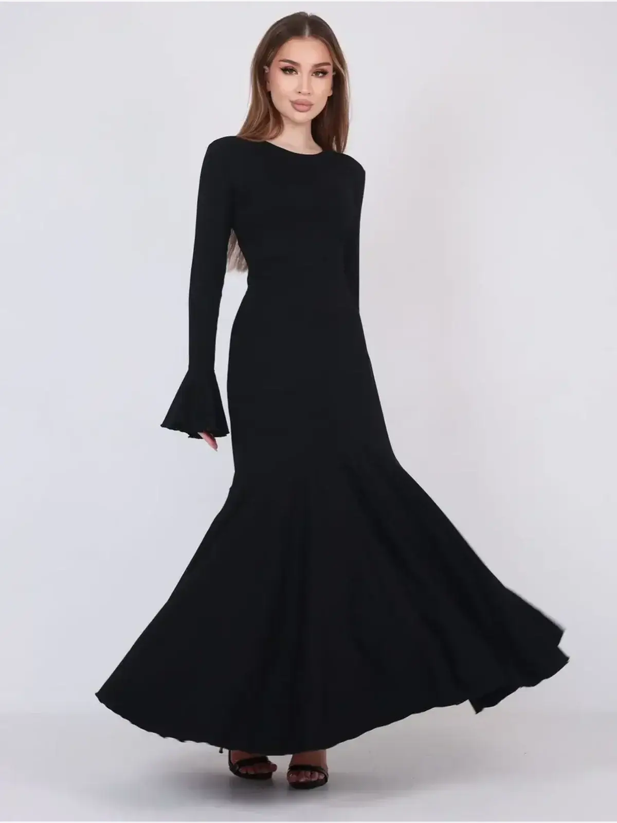 Mirage Maxi Dress in black, featuring flared cuffs and a fishtail hem for an elegant silhouette, perfect for evening wear.