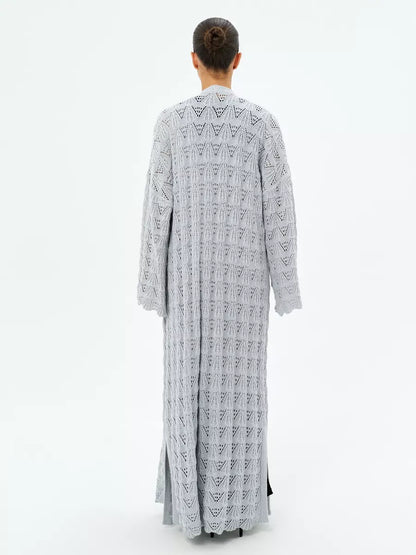 Back view of Lauven Mist Cardigan, showcasing its lightweight openwork knit design and delicate lace patterns.