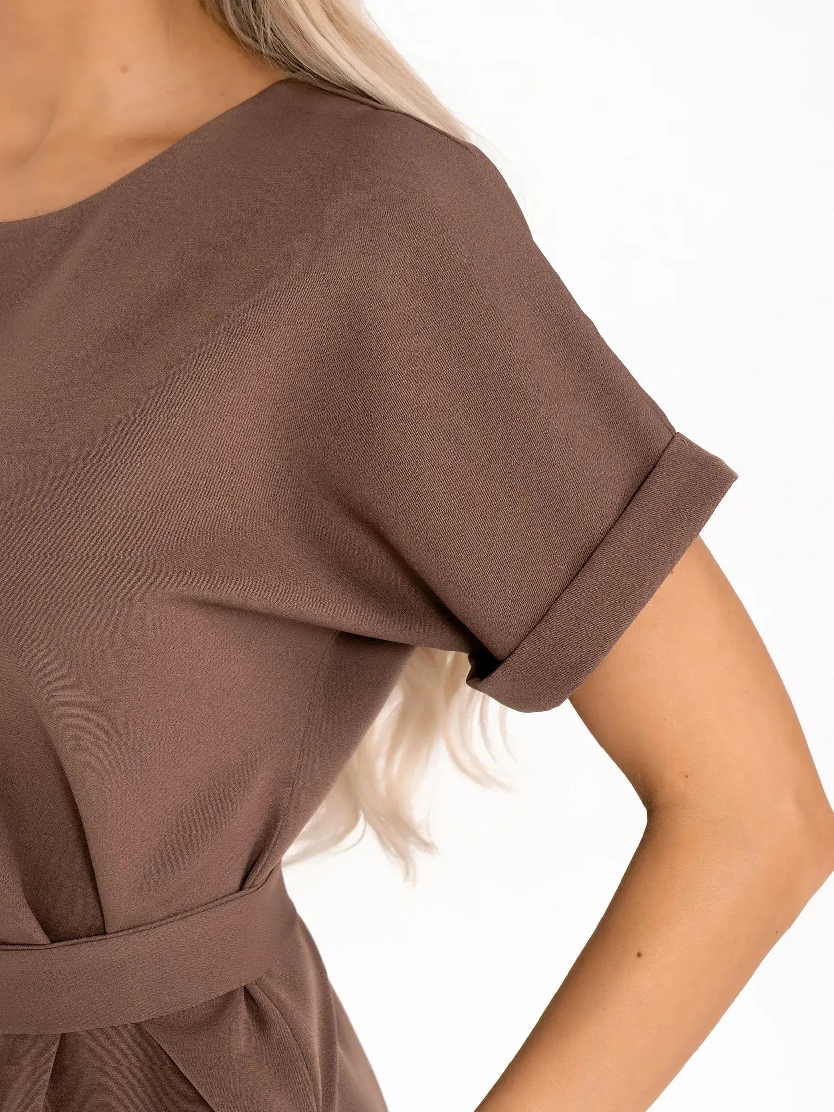 Close-up of Mocha Frame dress showcasing its sleek short sleeves and structured design in rich taupe tones.
