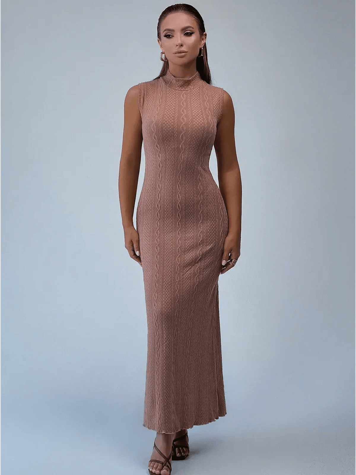 Museline Maxi Dress in cocoa-toned jacquard, showcasing a sleek bodycon fit with intricate cable patterns and modern stand collar.