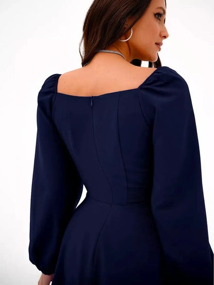 Navy blue long sleeve mini dress featuring a square neckline and elegant puffed shoulders.