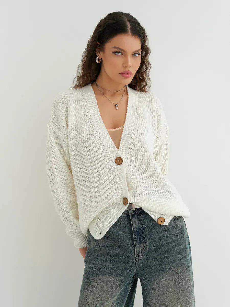 Noelle Cardigan by Lauven – Elegant white oversized knitwear with button detailing, perfect for layering and versatile styling.