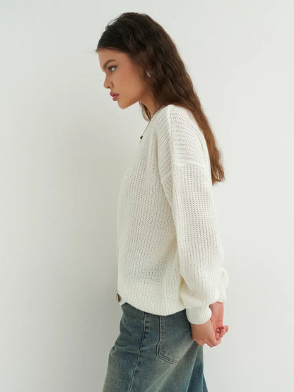 Noelle Cardigan by Lauven, an elegant white knitwear piece with button detailing and an oversized silhouette.