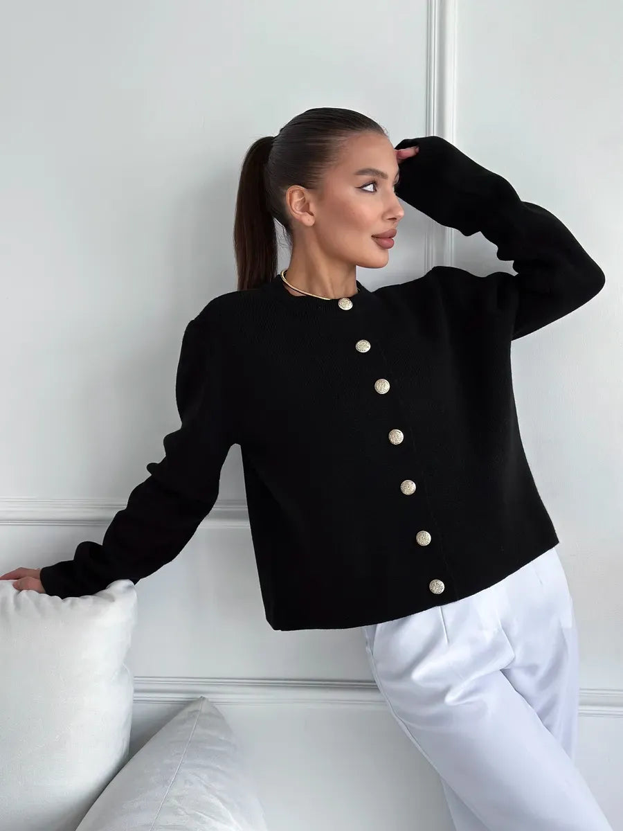Model wearing Noir Cardigan by Lauven, an elegant cropped black knitwear piece with buttons.