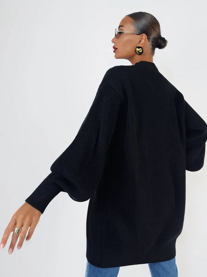 Noir Cardigan by Lauven, oversized black knit with statement buttons, ideal for modern styling.