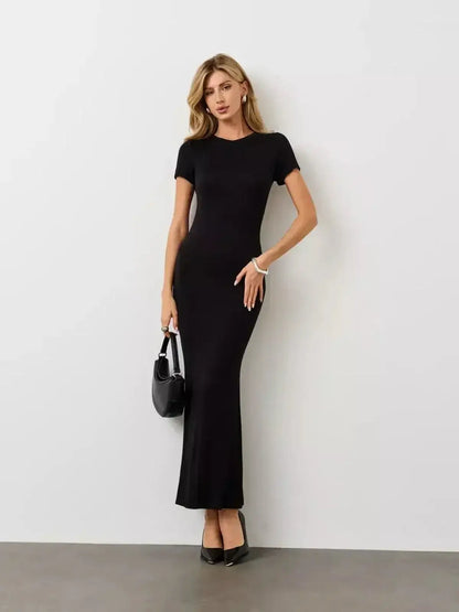 Noir Curve Maxi Dress by Lauven in black featuring a sculpted silhouette with short sleeves and a flared maxi hem.