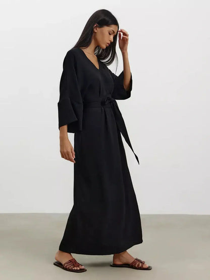 Noir Drift Maxi Dress featuring kimono sleeves, V-neckline, and softly sculpted belt for effortless elegance.