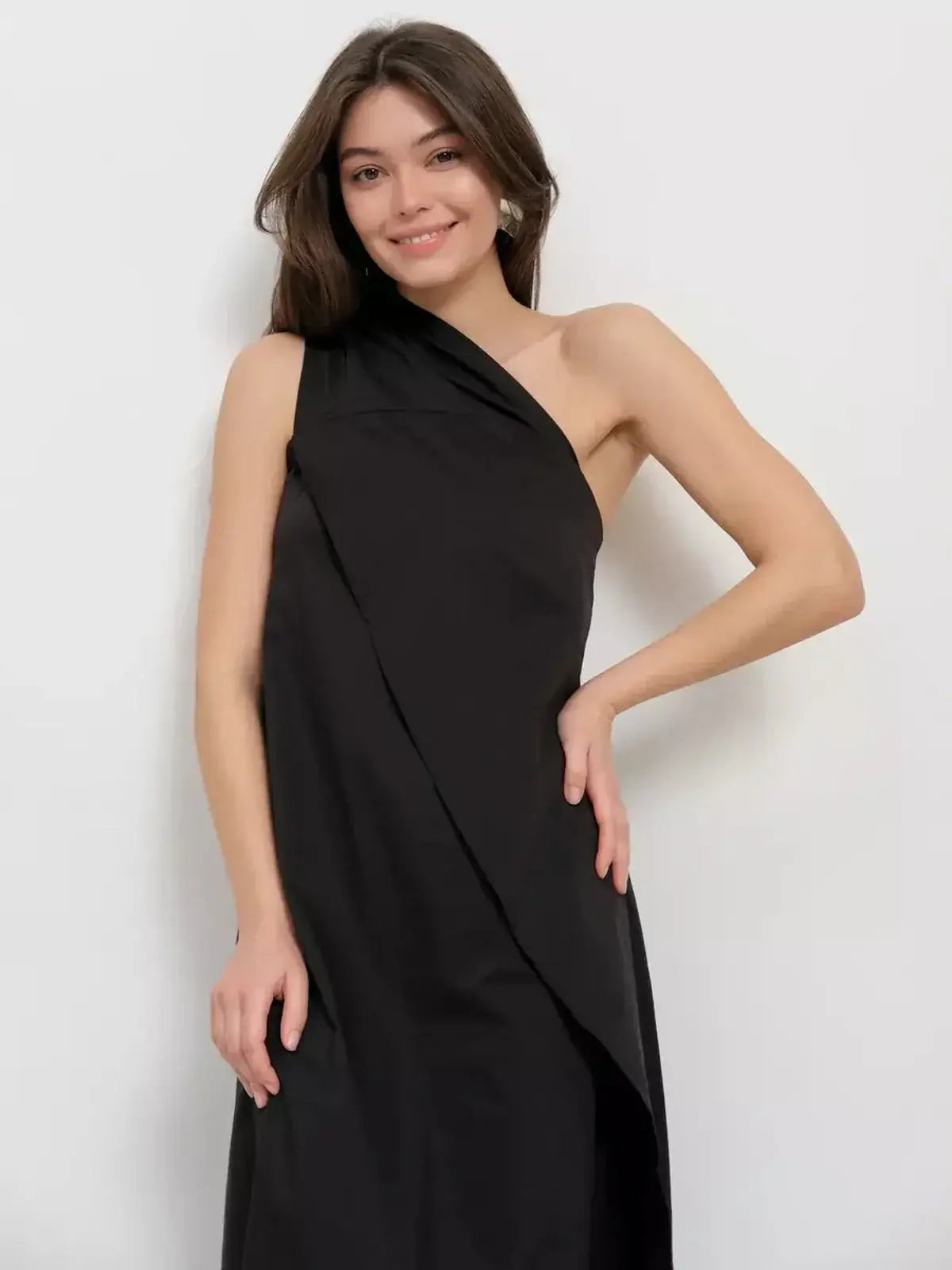 Model wearing a Noir Fold Maxi Dress featuring a one-shoulder design and draped silhouette.