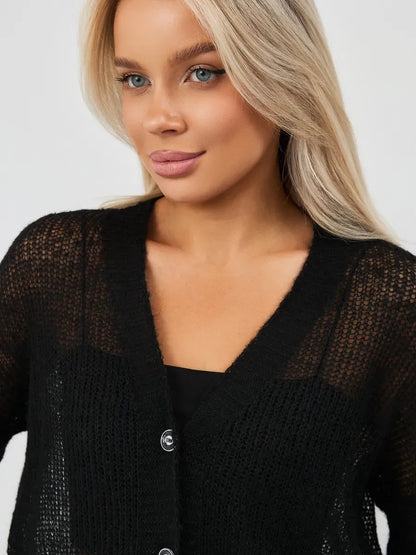 Model showcasing the Noir Luxe Cardigan, an oversized mohair-blend knitwear by Lauven in elegant black.