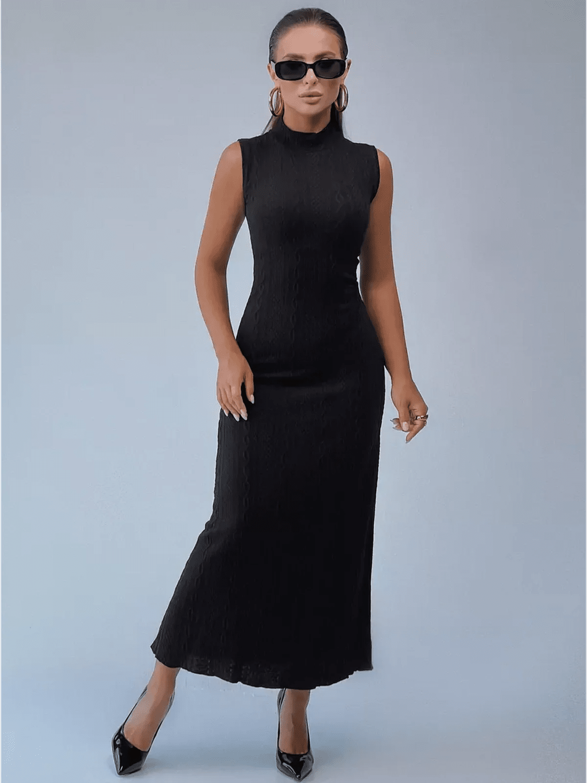 Noir Sculpt Maxi Dress in black, showcasing a sleek fit with high-neck silhouette and modern elegance.