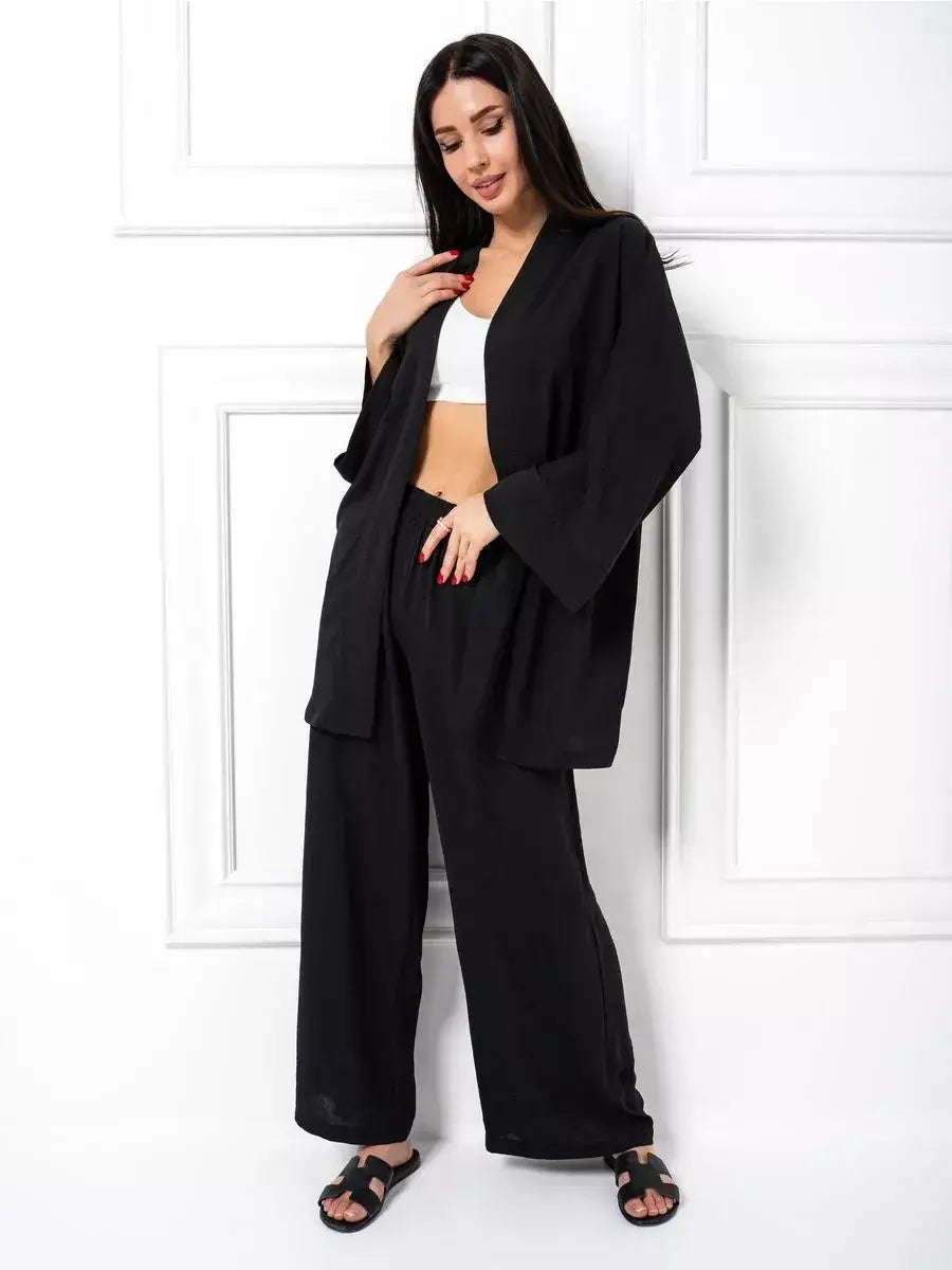 Noir Suit Set by Lauven showing a chic oversized two-piece set in classic black with wide-leg trousers.