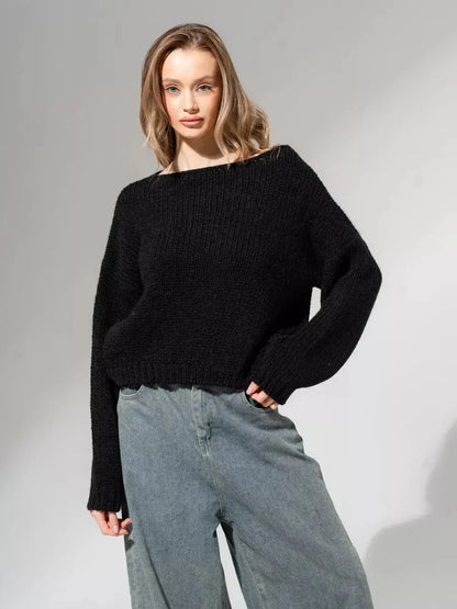 Noir Sweater in classic black by Lauven, featuring an oversized off-shoulder knit design for a modern minimalist look.