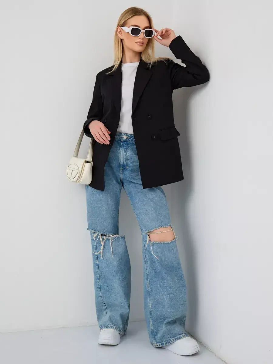 Model wearing Nova Blazer by Lauven with oversized jeans and stylish accessories, showcasing modern women's fashion.