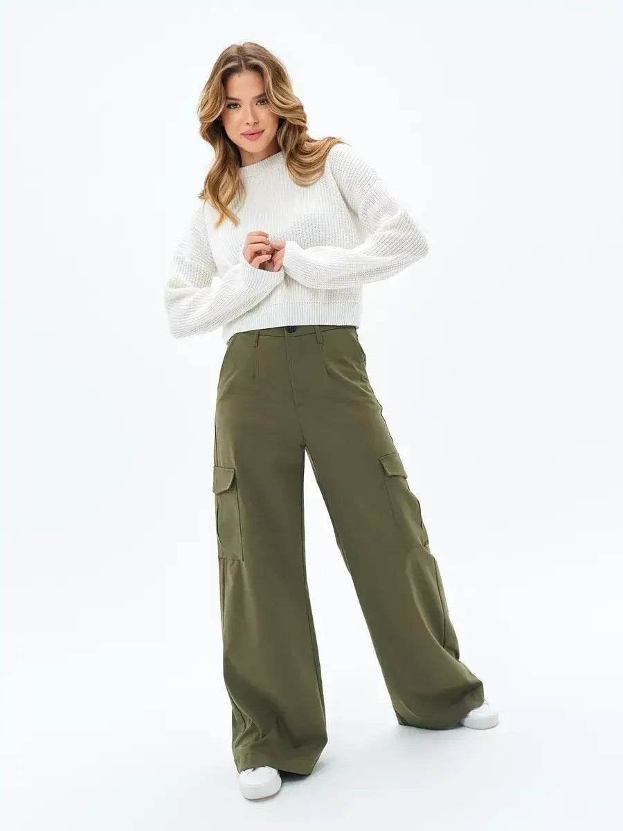 Woman wearing a Nova Sweater and olive green cargo pants, showcasing casual and stylish outfit by Lauven.