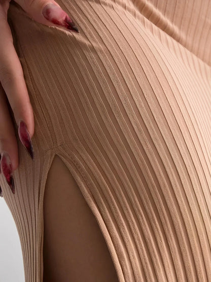 Close-up of the Nude Lace Midi Dress showcasing ribbed texture and thigh-high slit for a minimalist chic look.