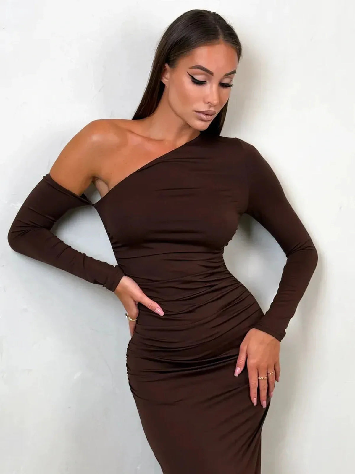 Obsidian Curve Maxi Dress in chocolate-brown with one-shoulder design, perfect for evening wear and formal occasions.