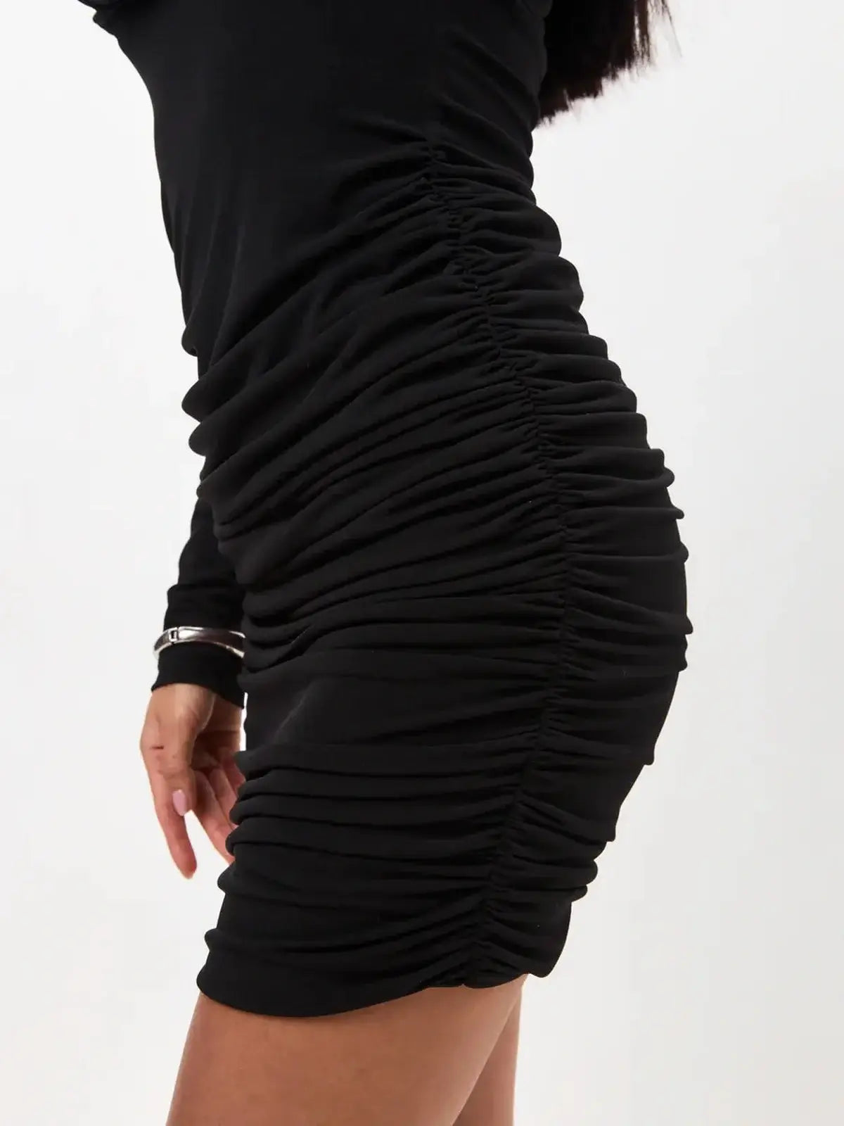 Black one-shoulder mini dress with sophisticated ruching and asymmetrical draping for a flattering silhouette.