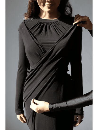Model showcasing the Obsidian Drape Maxi Dress, highlighting its elegant silhouette and gathered high neckline.
