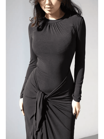 Obsidian Drape Maxi Dress showcasing a sculpting fit and fluid drape with gathered high neckline and knot detail.